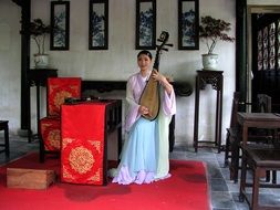 cute asian girl with musical instrument