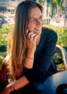 photo of a smiling girl talking on a cell phone