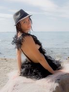 Pretty young woman on a sand beach