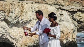 dark skin Wedding Couple at rock