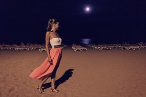 young woman on beach at night, spain, canary islands