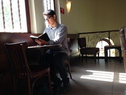 student with a book in their hands