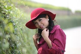 girl in pink hat posing