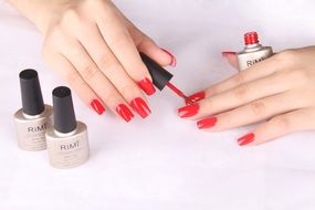 woman paints her nails