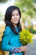 beautiful smling Young asian Girl with flowers outdoor