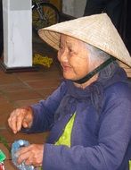 senior vietnamese woman in the hat