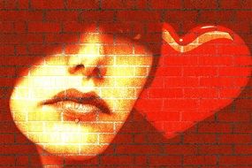 girl's face and heart on brick wall drawing