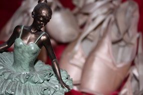 ballerina statuette on background pointes