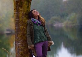 beautiful girl relaxes near the lake