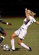 playing girl in white uniform in football
