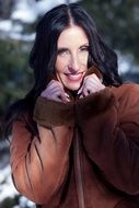 Portrait of happy brunette woman