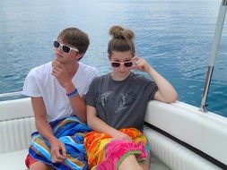 friends in sunglasses on a yacht