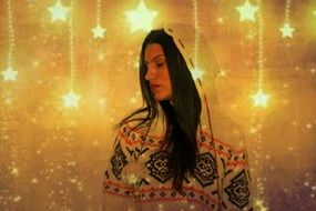 Girl in Hood looking aside at Christmas background