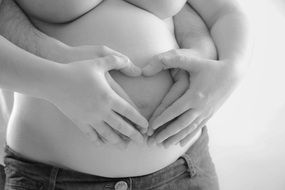 hands on the pregnant belly