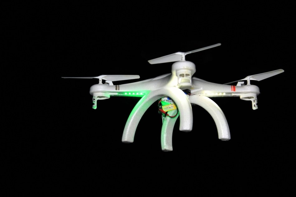 flying drone on the black background