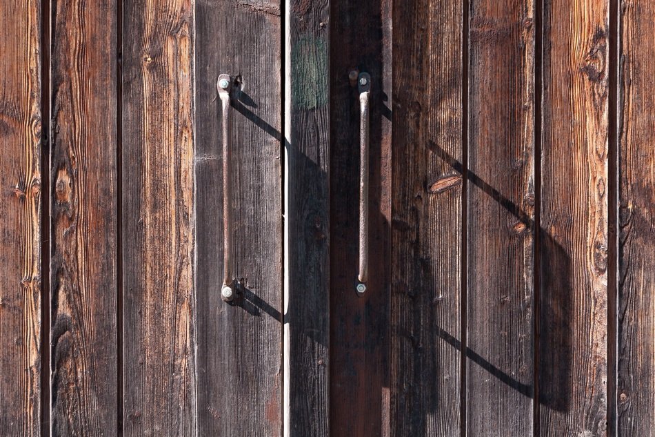 old wooden gate with iron handles