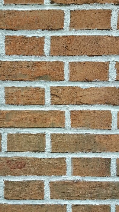 brick wall with white stripes