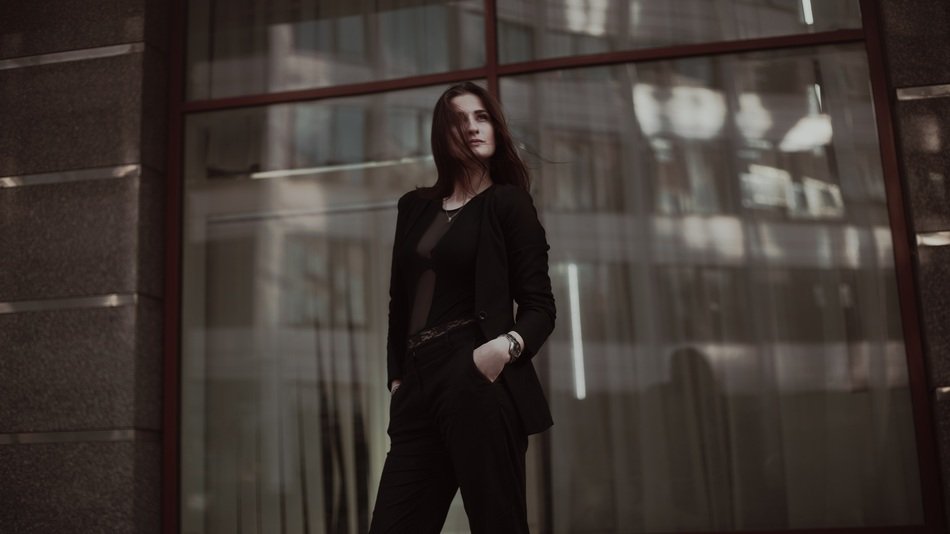 business lady stands near the window