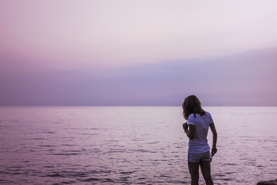 woman in summer clothes by the ocean