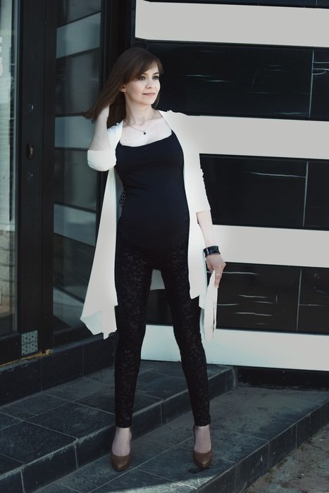 pregnant girl near the wall