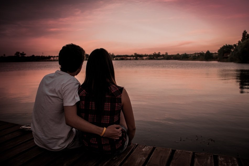 couple in love on the pier at sunset