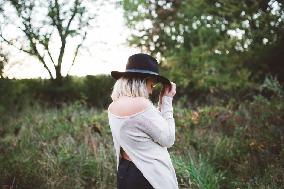 woman in white sweater and hat