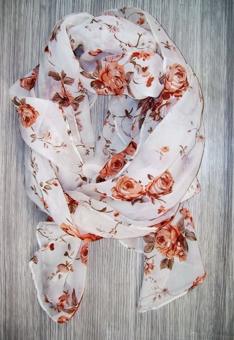 White and red scarf on gray background