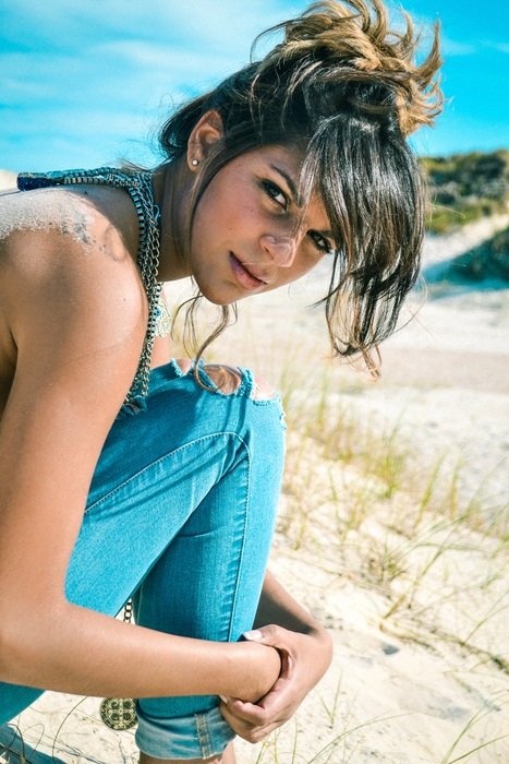woman in jeans on the beach