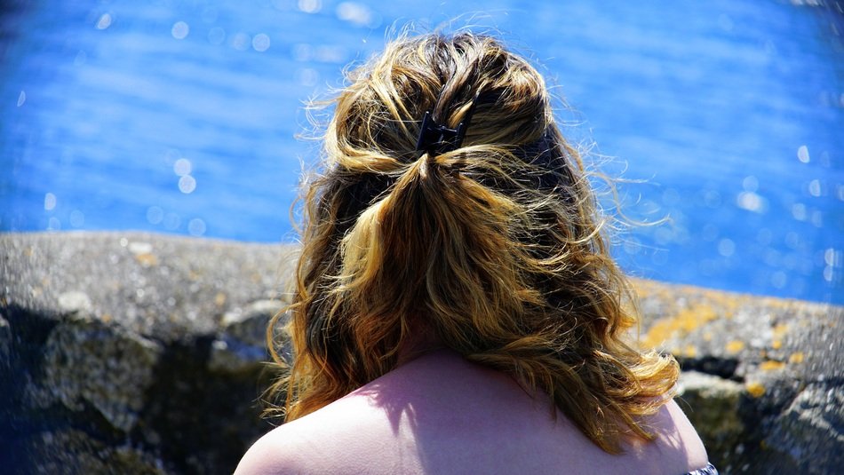 woman near the water on a sunny day