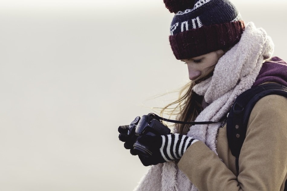 girl with a camera in winter