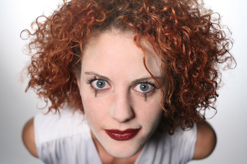 Woman with the red curly hair
