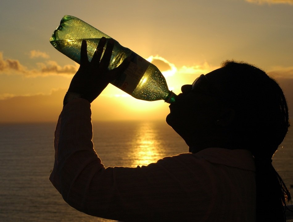 Woman drinking water from a bottle