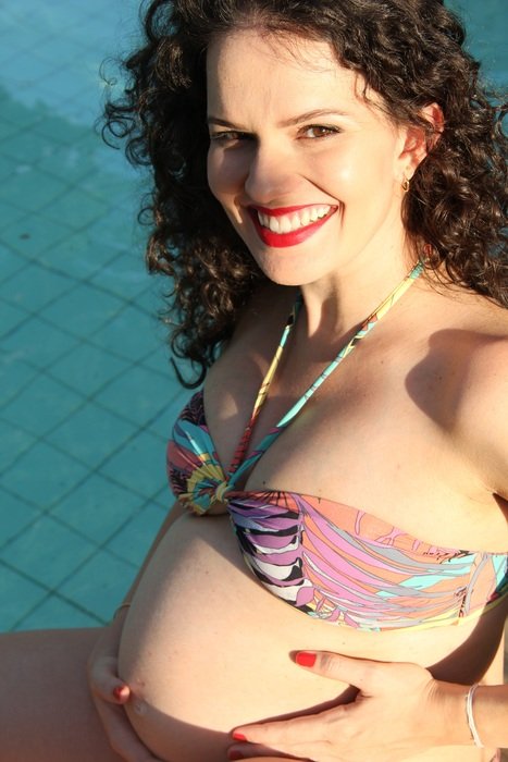 happy beautiful Pregnant Woman in bikini