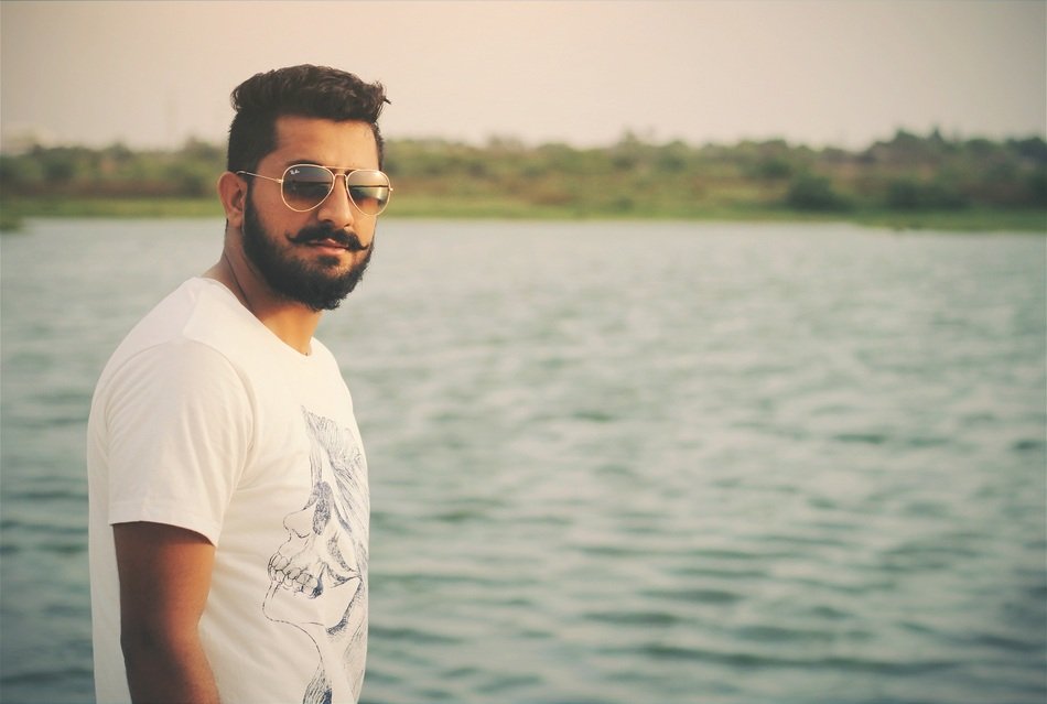 Man with the beard near the water