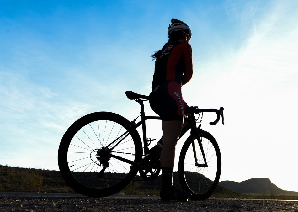 silhouette of a woman on bicycles