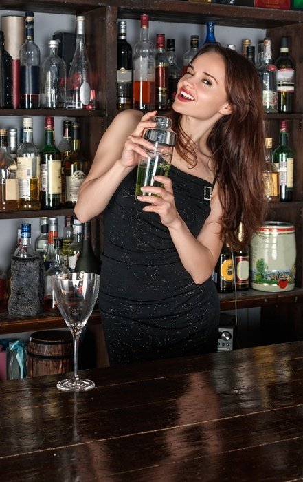 girl with a bottle in hand at the bar