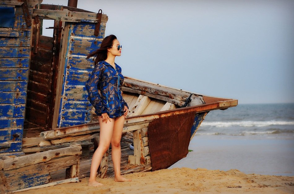 girl standing near the boat
