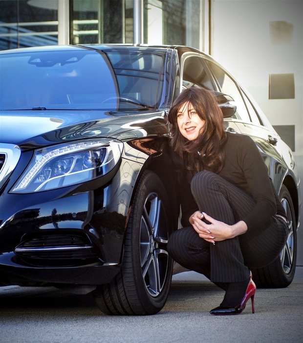 business lady near black mercedes