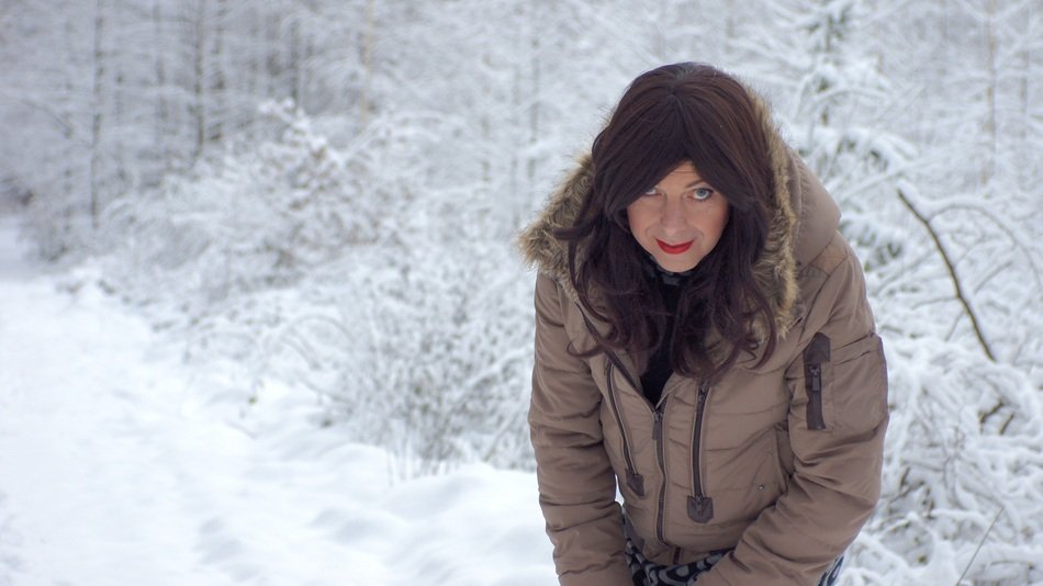 woman in the snowy forest in winter