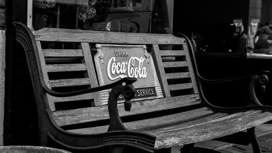 old bench with the word 'Coca-Cola'