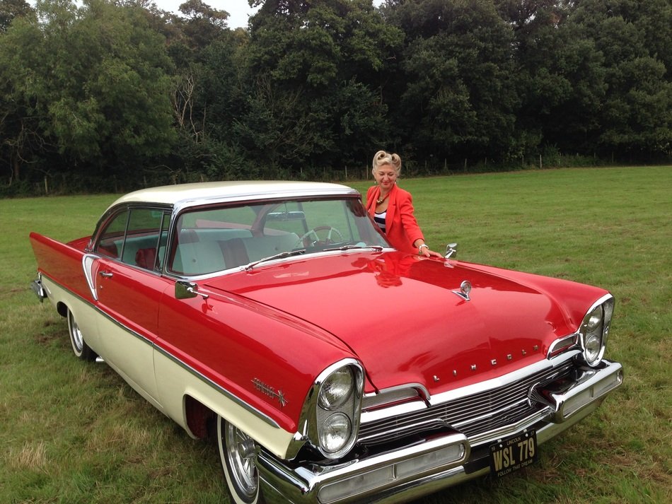 girl in red at the red retro car