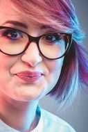 Portrait of cute woman with glasses and pink hair