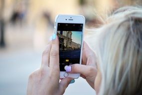 insanely beautiful Social Media Girl taking a photo