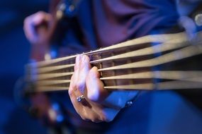 Man playing on a Bass Guitar