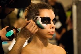artistic face painting on a woman