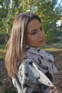 young woman in scarf in profile
