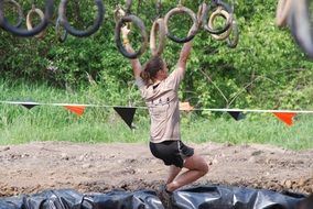 woman on sports rings