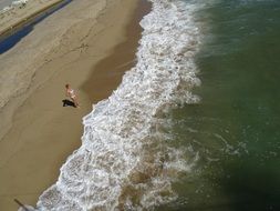 aerial view of a woman on a summer beach