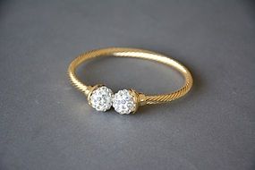 gold ring on a gray surface