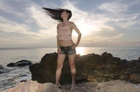 woman with long hair at sunset